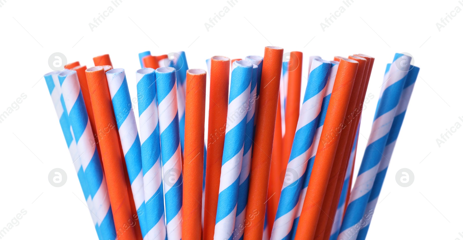 Photo of Striped paper cocktail tubes on white background