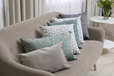 Photo of Sofa with pillows in modern living room interior