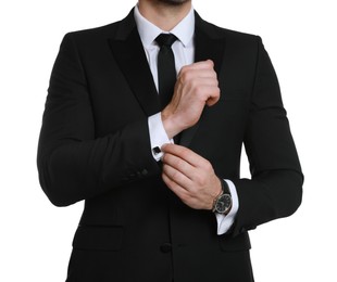 Man wearing stylish suit and cufflinks on white background, closeup