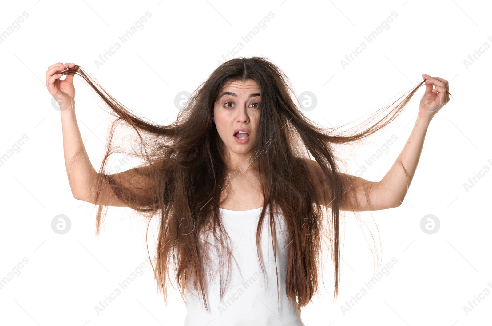 Photo of Emotional woman with tangled hair on white background