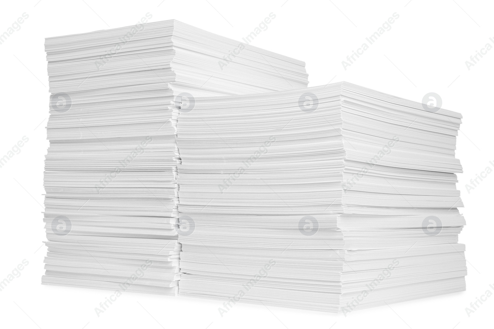 Photo of Stacks of paper sheets isolated on white