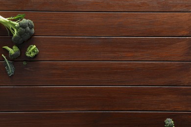 Photo of Food photography. Fresh broccoli on wooden table, flat lay with space for text