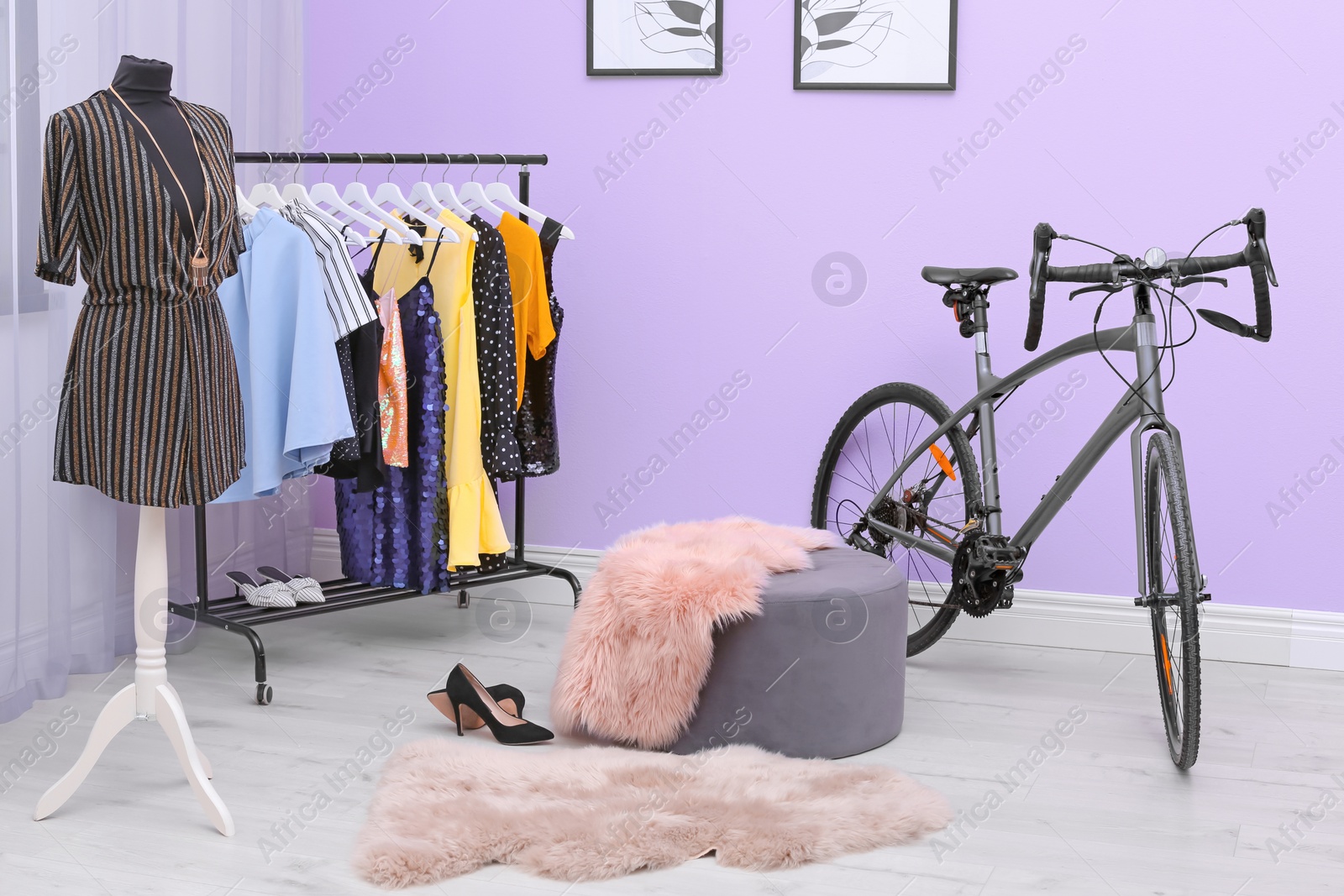 Photo of Modern bicycle in stylish dressing room interior