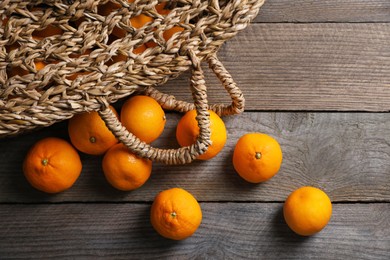 Many fresh ripe tangerines on wooden table, flat lay