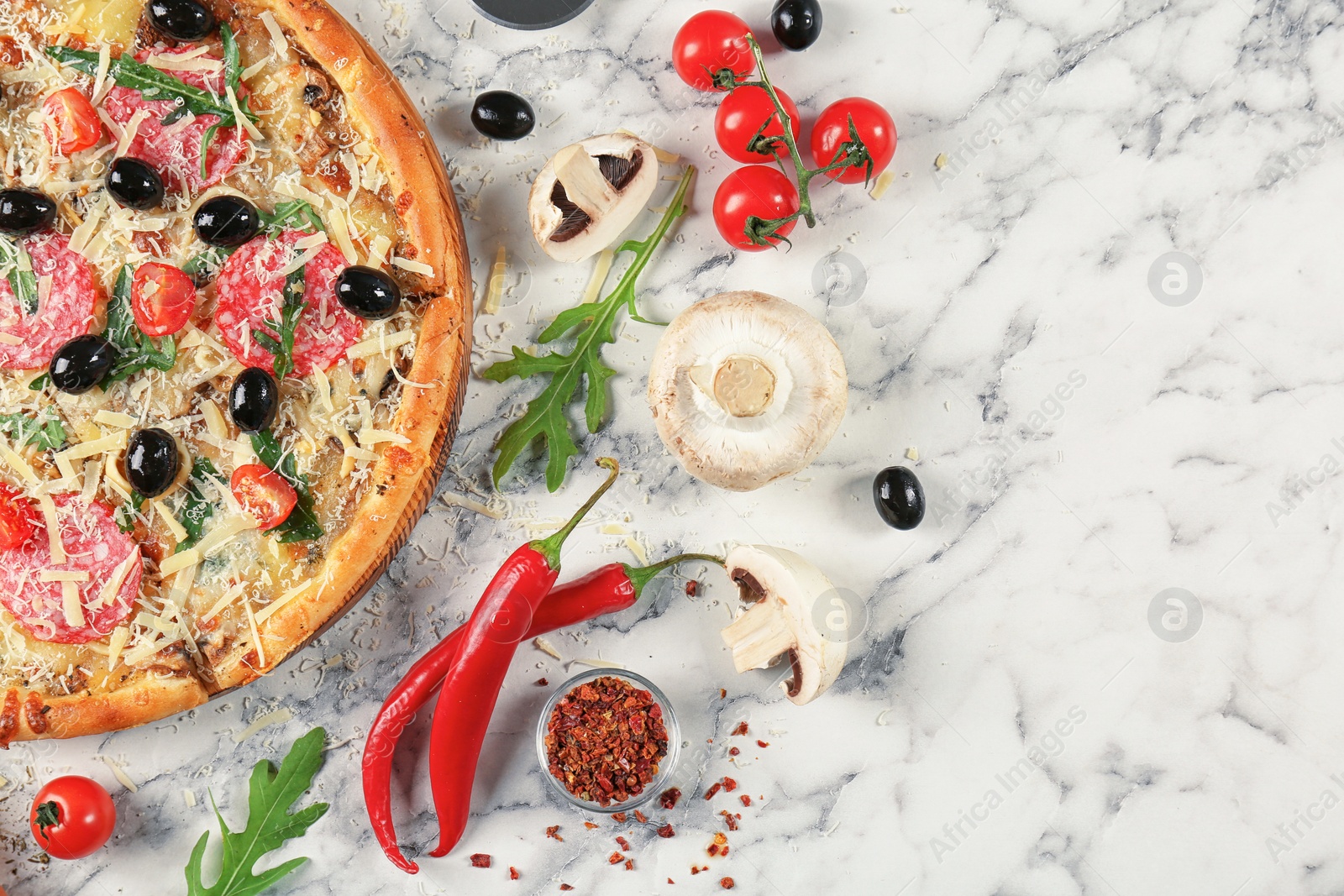 Photo of Composition with delicious pizza and ingredients on marble background, top view