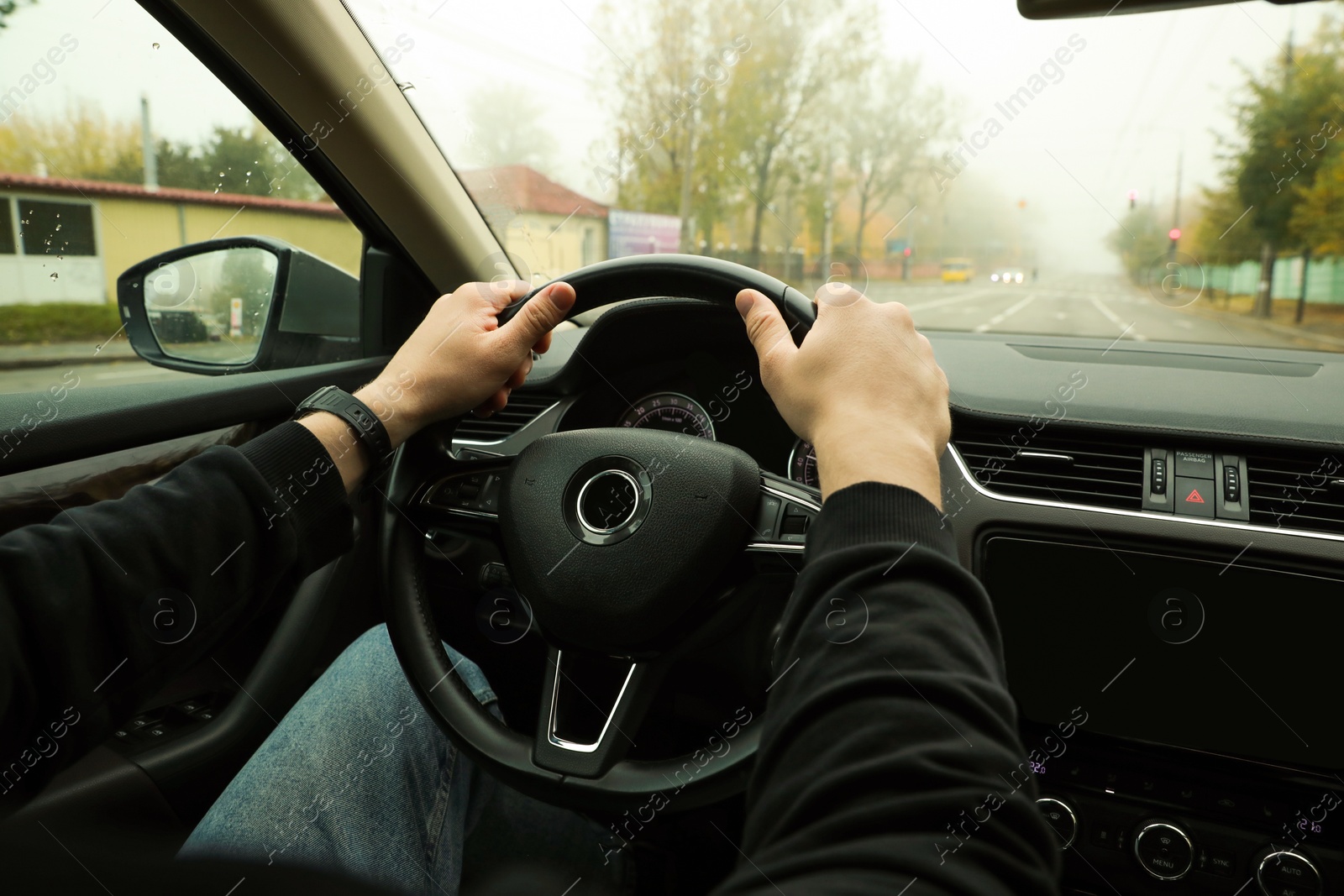 Photo of Man driving his car, closeup. Traffic rules