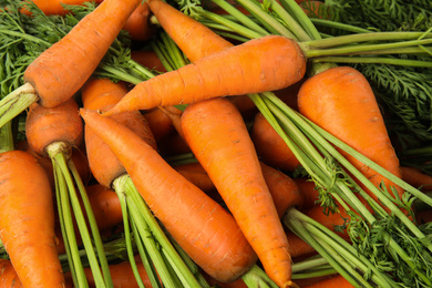 Photo of Fresh ripe carrots as background, closeup view