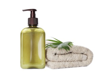 Photo of Bottle of shampoo and terry towel on white background