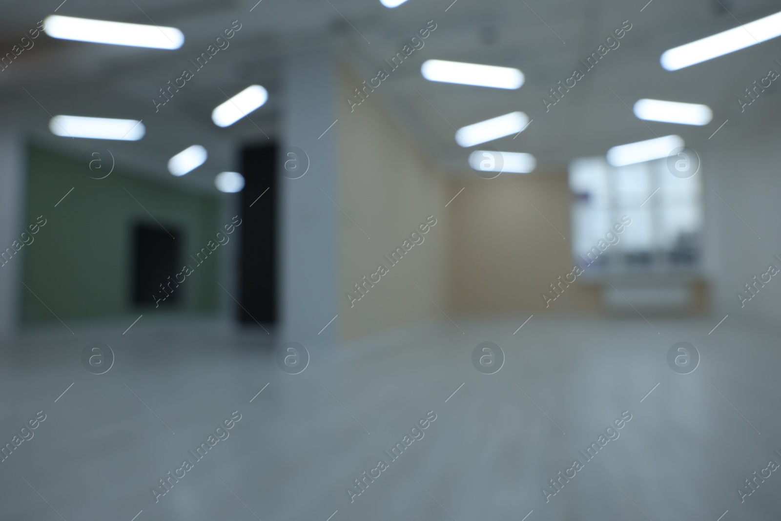 Photo of Blurred view of new empty room with windows