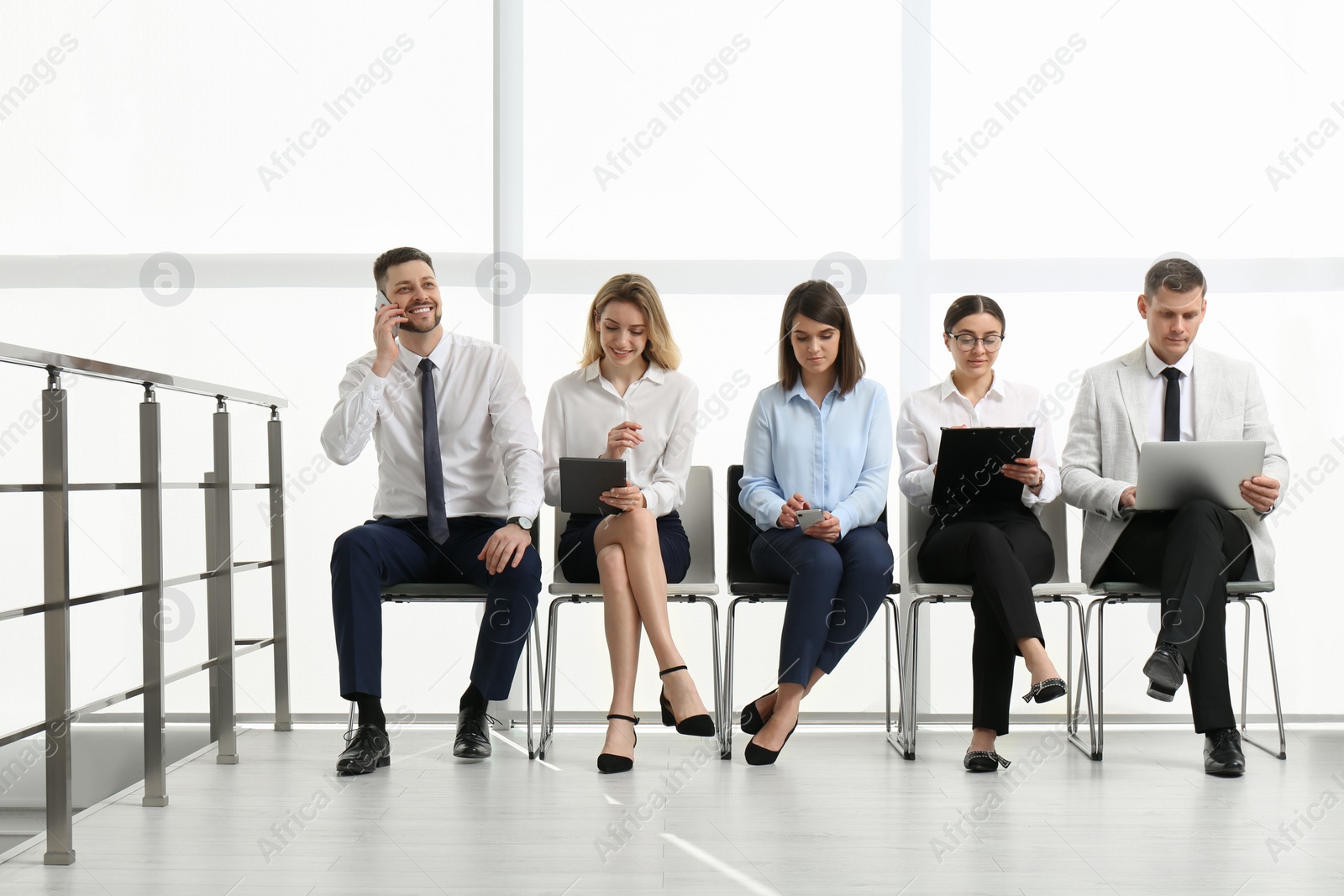 Photo of People waiting for job interview in office hall