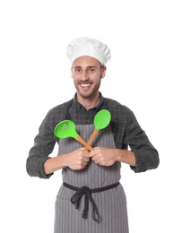 Professional chef with kitchen tools on white background