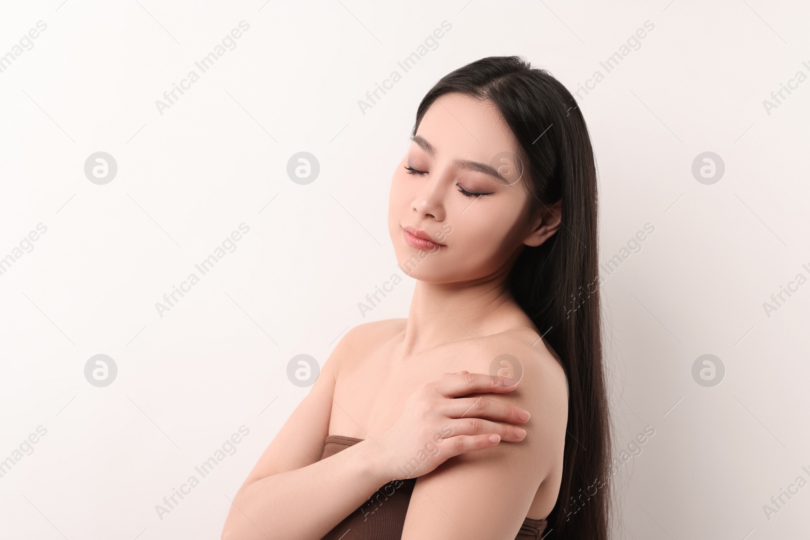 Photo of Portrait of beautiful woman on white background