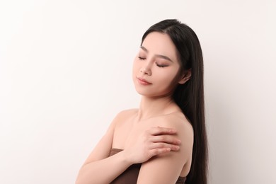 Portrait of beautiful woman on white background