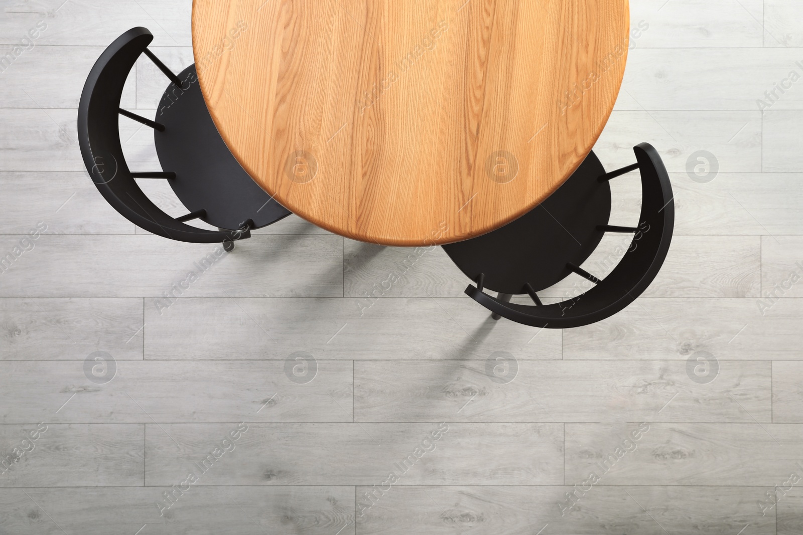 Photo of Empty wooden table and chairs indoors, top view. Stylish furniture