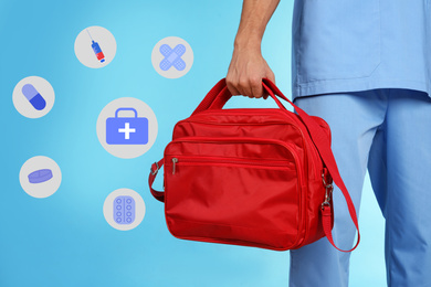 Image of Doctor with first aid kit on light blue background, closeup