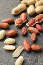 Photo of Fresh peanuts on grey table. Healthy snack