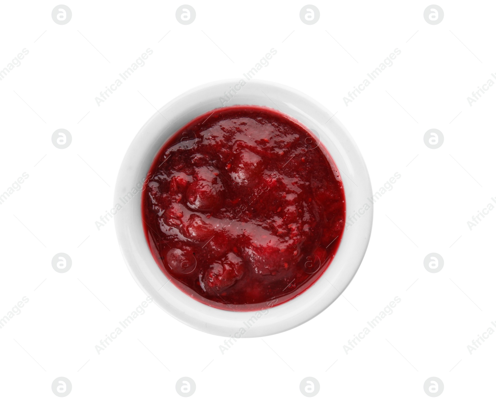Photo of Bowl of cranberry sauce on white background, top view