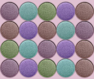 Image of Collage of beautiful different eye shadow refill pans on pastel background