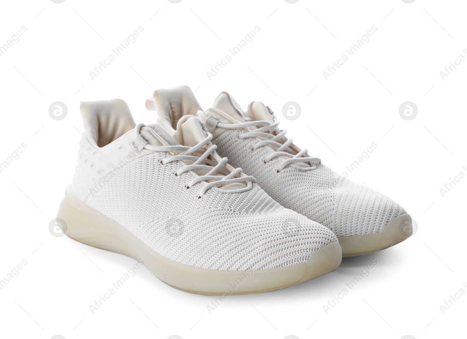 Photo of Pair of stylish sneakers on white background