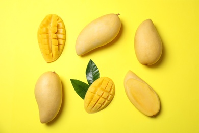 Photo of Flat lay composition with mango fruits on color background