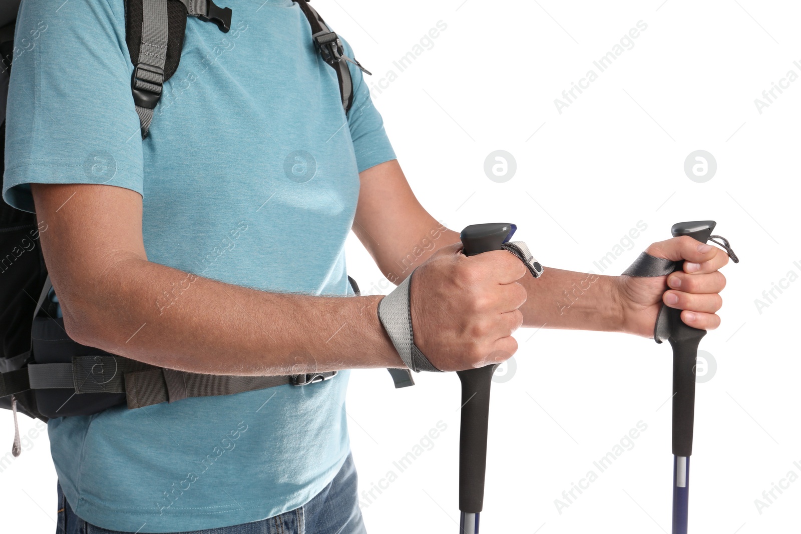 Photo of Male hiker with backpack and trekking poles on white background, closeup