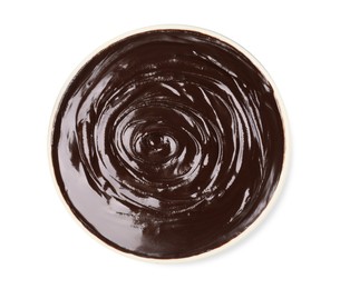 Delicious chocolate cream in bowl on white background, top view