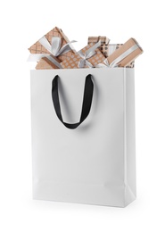 Paper shopping bag with handles full of gift boxes on white background. Mock up for design