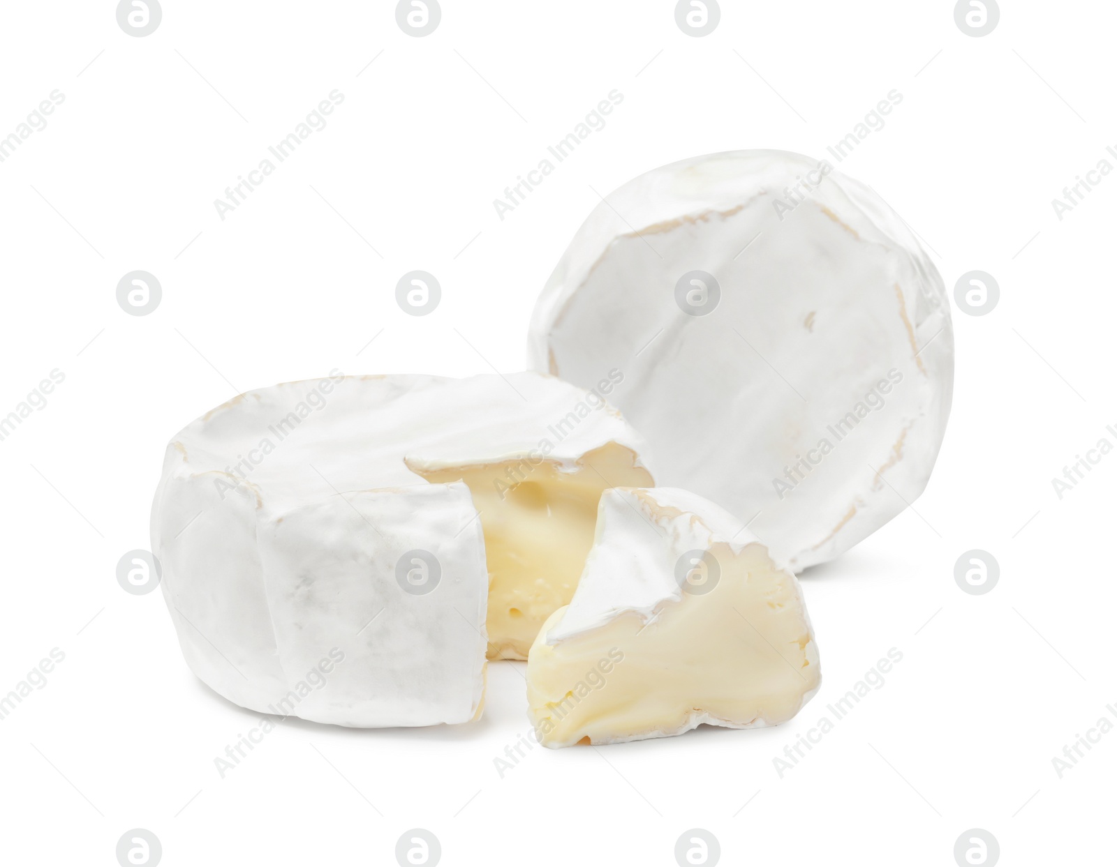 Photo of Tasty cut and whole brie cheeses on white background