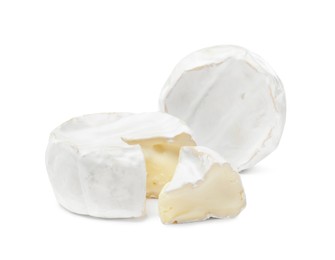 Photo of Tasty cut and whole brie cheeses on white background