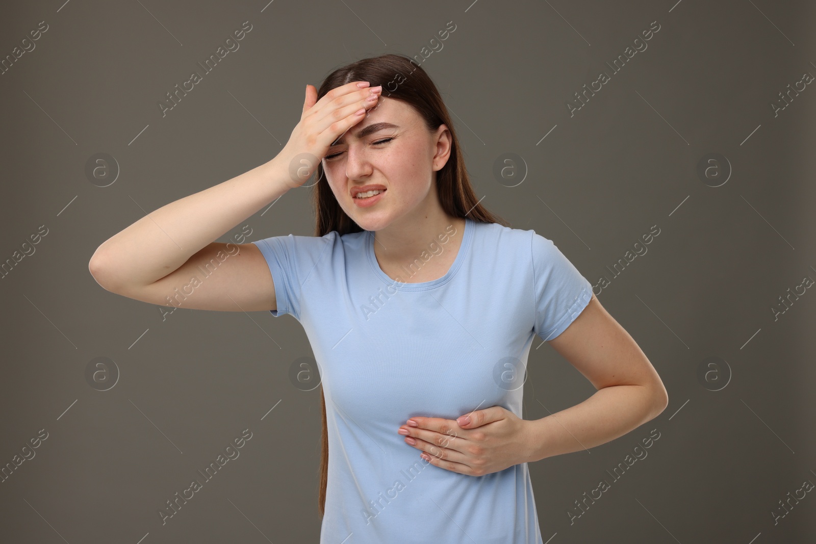Photo of Woman having heart attack on grey background