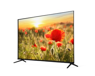 Modern wide screen TV monitor showing beautiful poppy flowers in field at sunset isolated on white