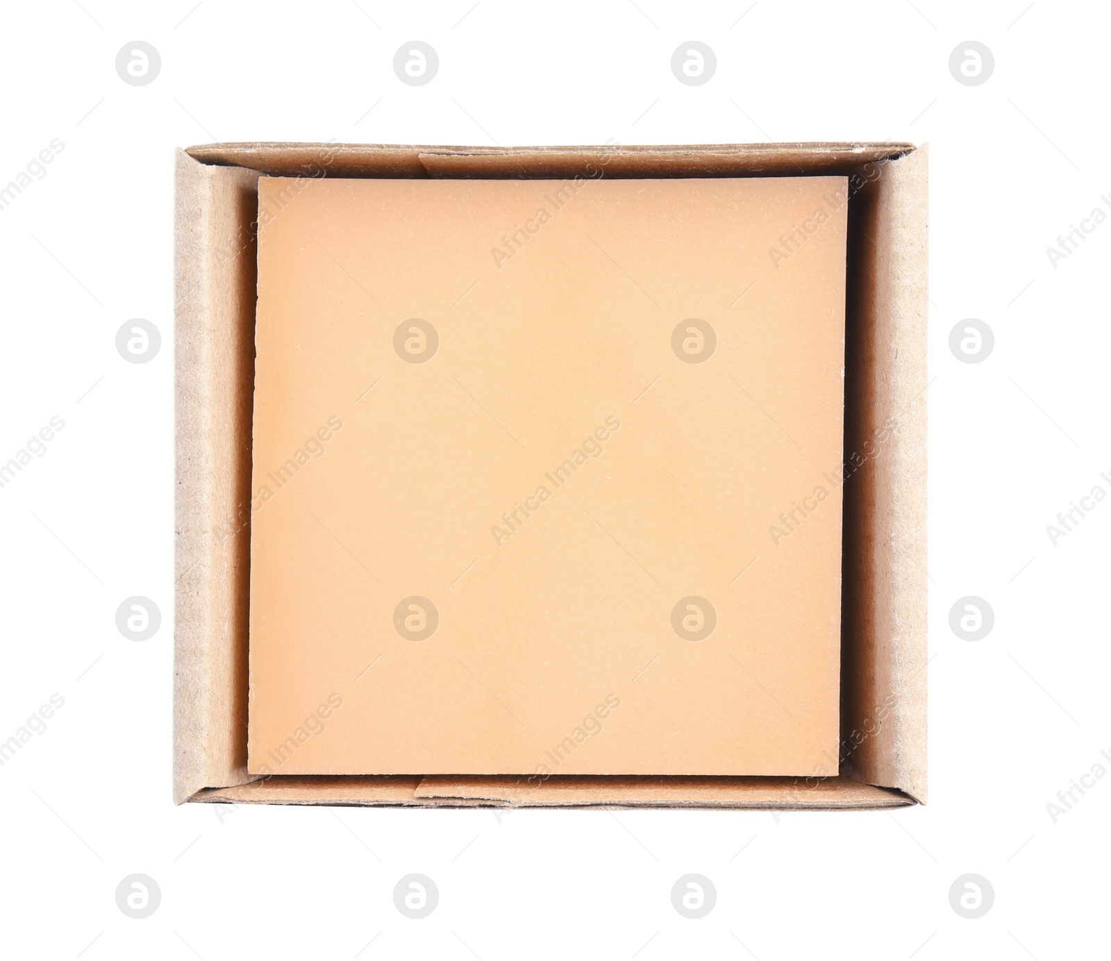 Photo of Hand made soap bar in cardboard package on white background, top view