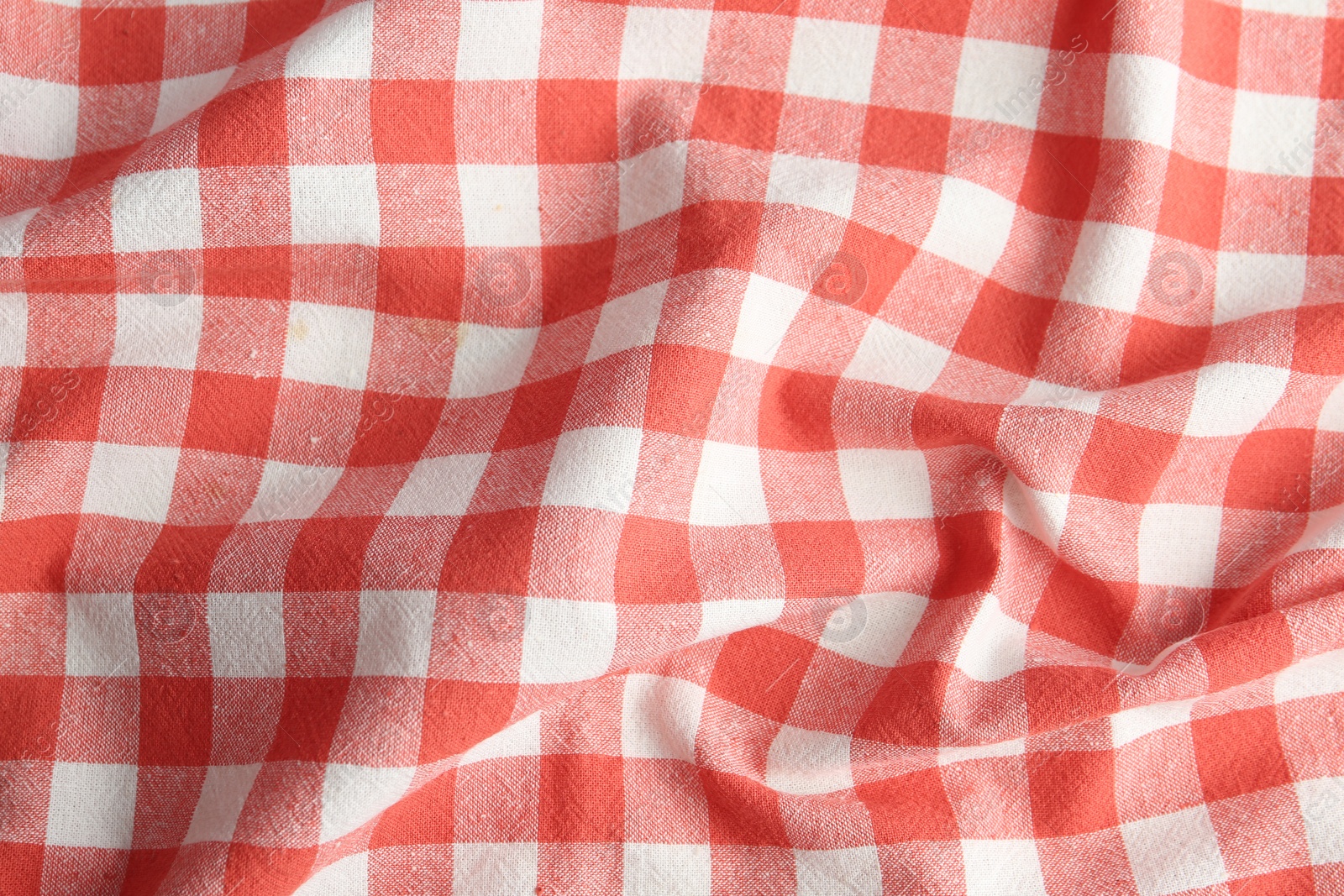 Photo of Texture of red checkered fabric as background, closeup