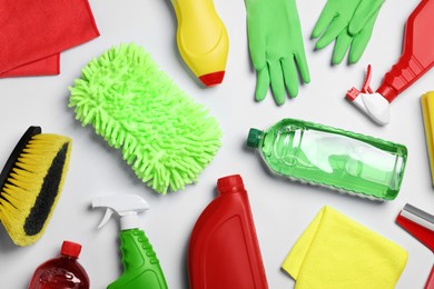 Flat lay composition with different car wash products on white background