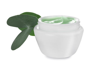 Photo of Jar of organic cream and leaves isolated on white