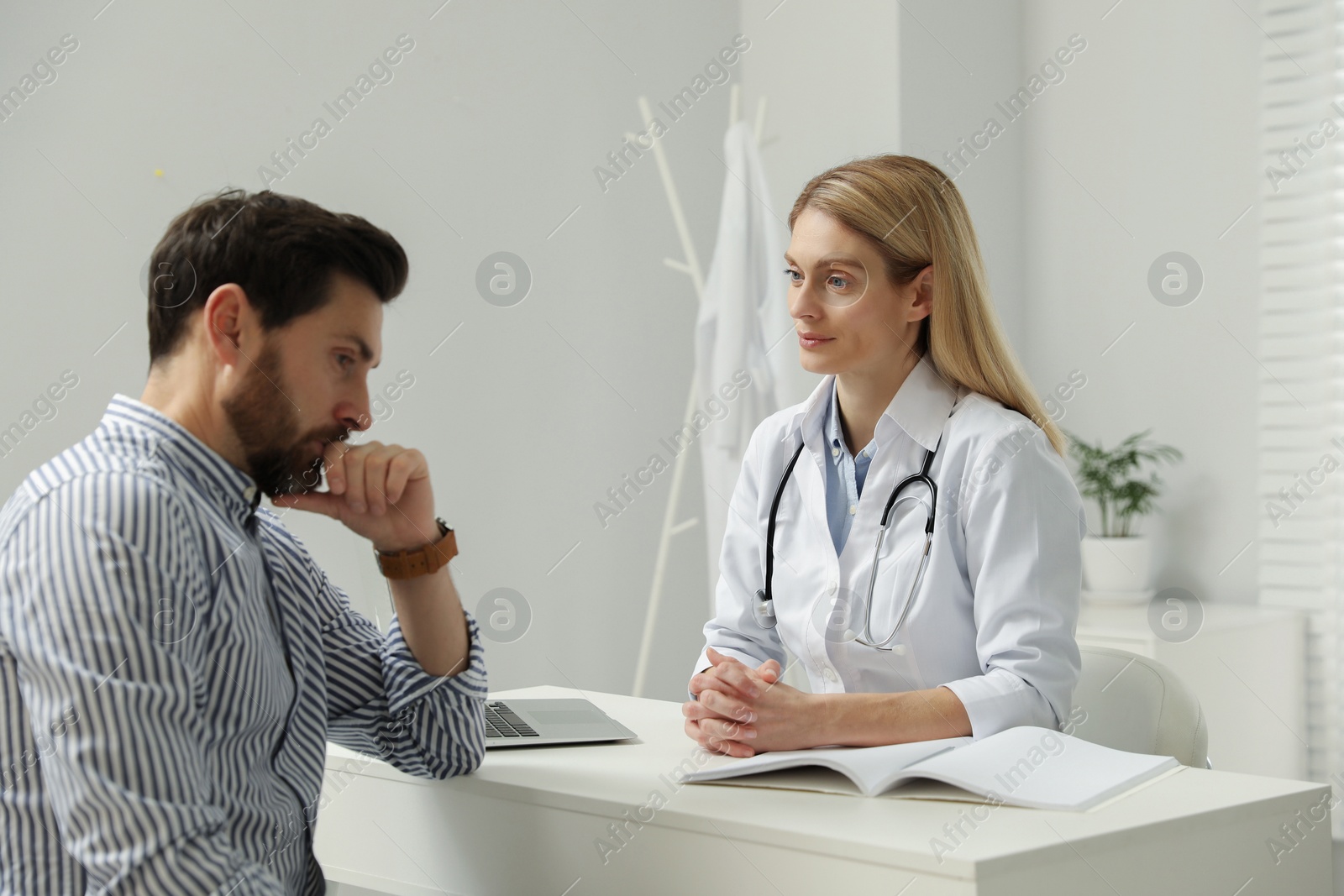 Photo of Patient having appointment with doctor in clinic