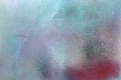 Photo of Texture of abstract spray paint as background, top view