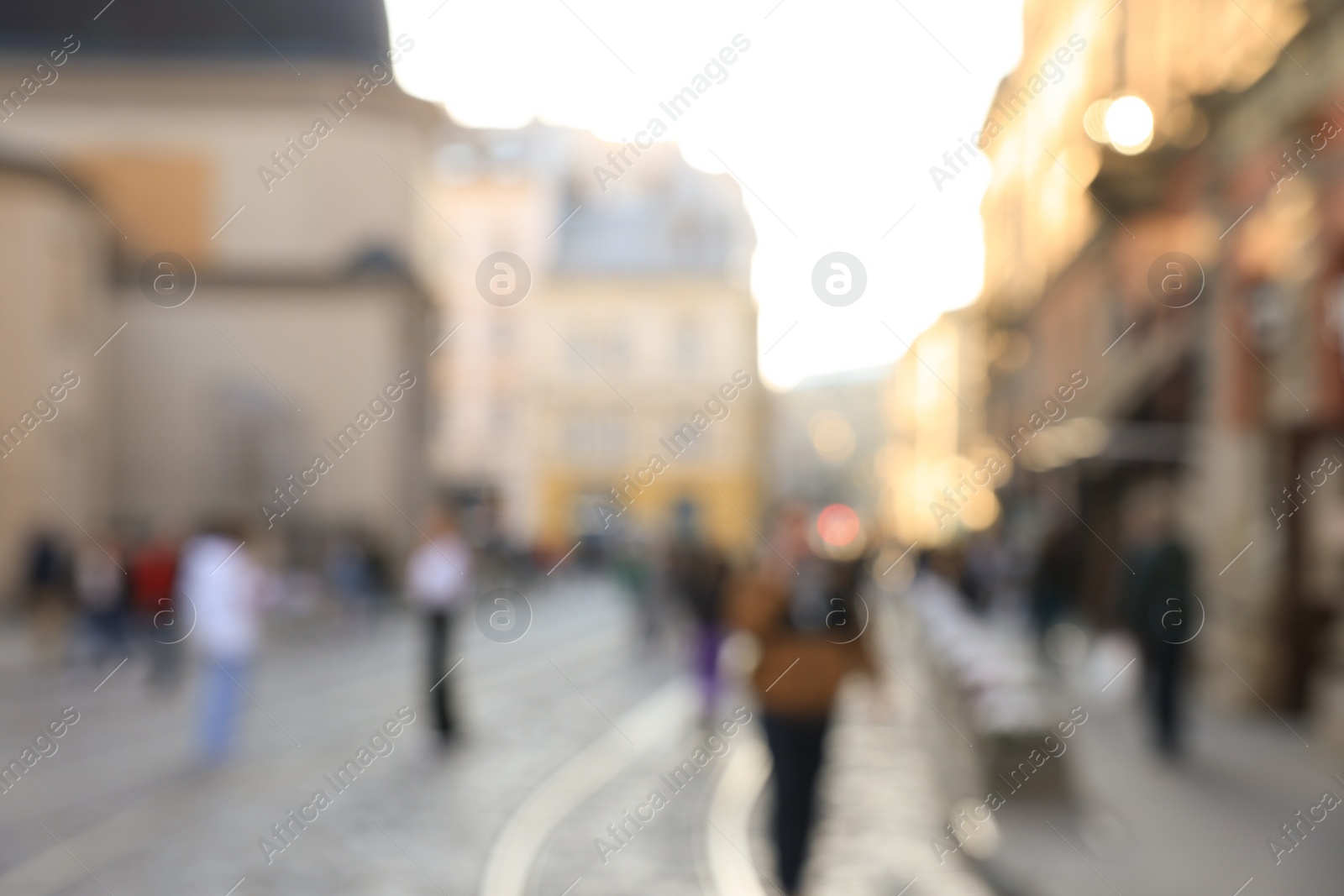 Photo of Blurred view of people walking on city street