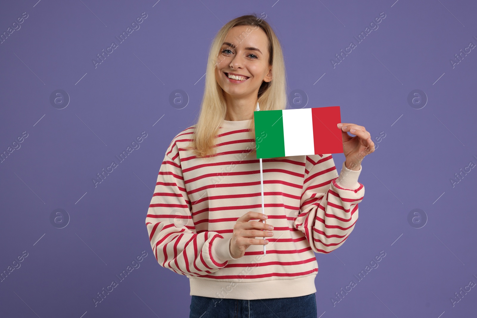 Image of Happy young woman with flag of Italy on purple background