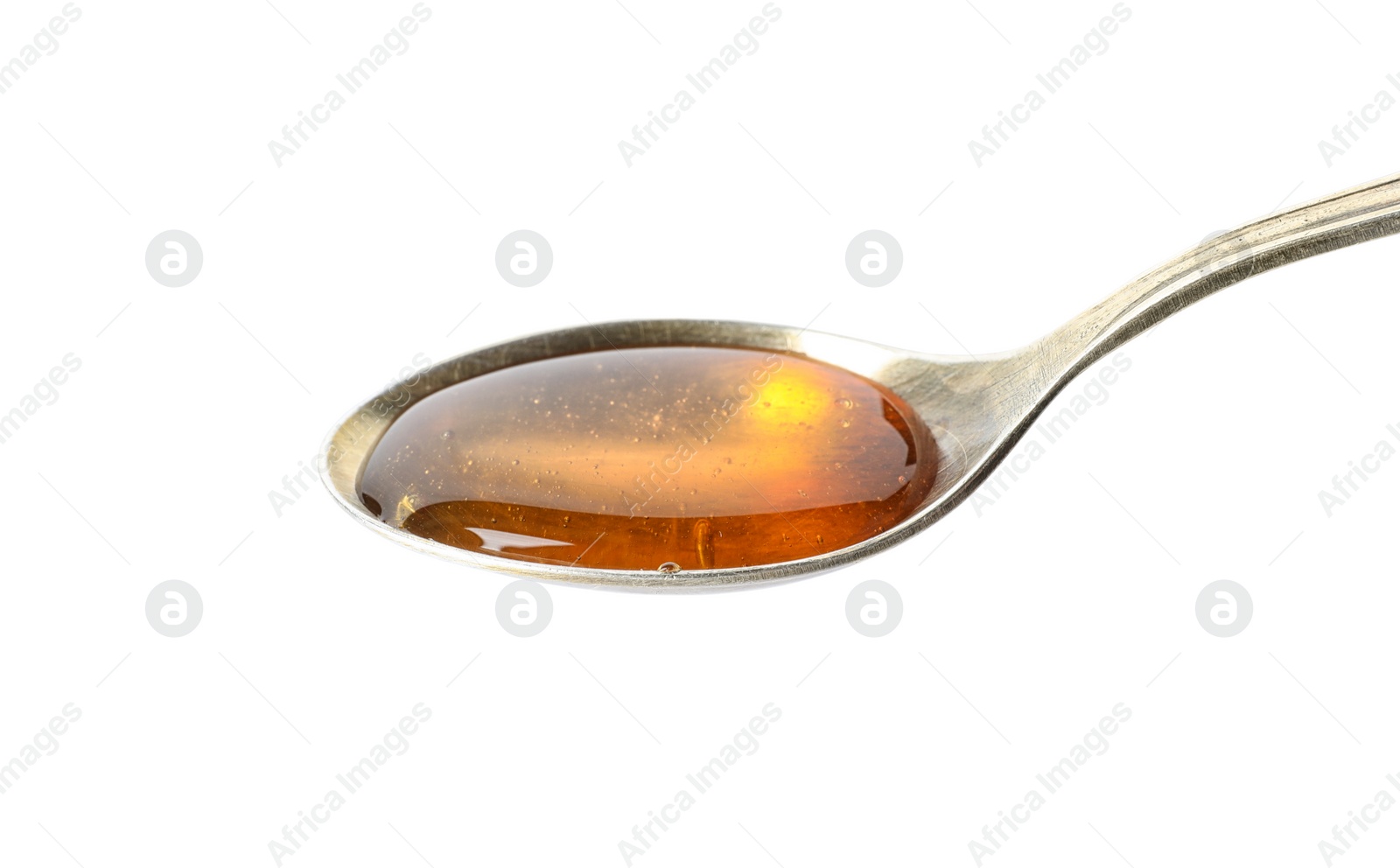 Photo of Spoon with delicious honey on white background