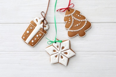 Photo of Different delicious Christmas cookies on white wooden table, flat lay