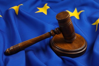 Wooden judge's gavel on flag of European Union