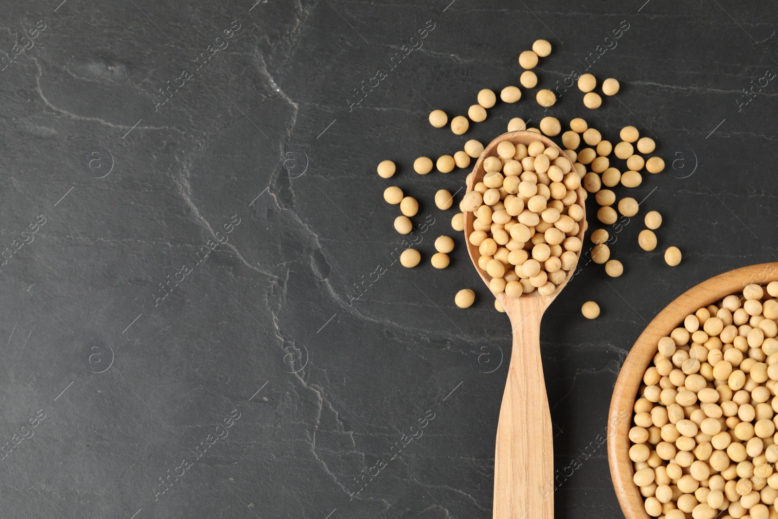 Photo of Soy on black table, flat lay. Space for text