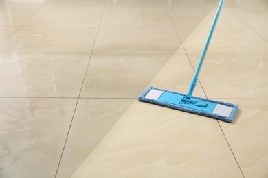 Image of Washing of floor with mop. Difference before and after cleaning