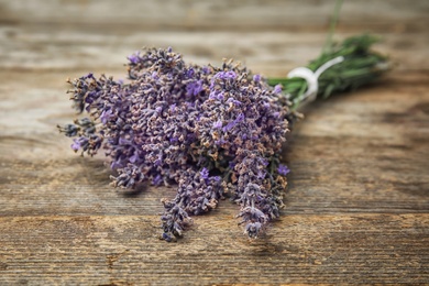 Beautiful blooming lavender flowers on wooden table