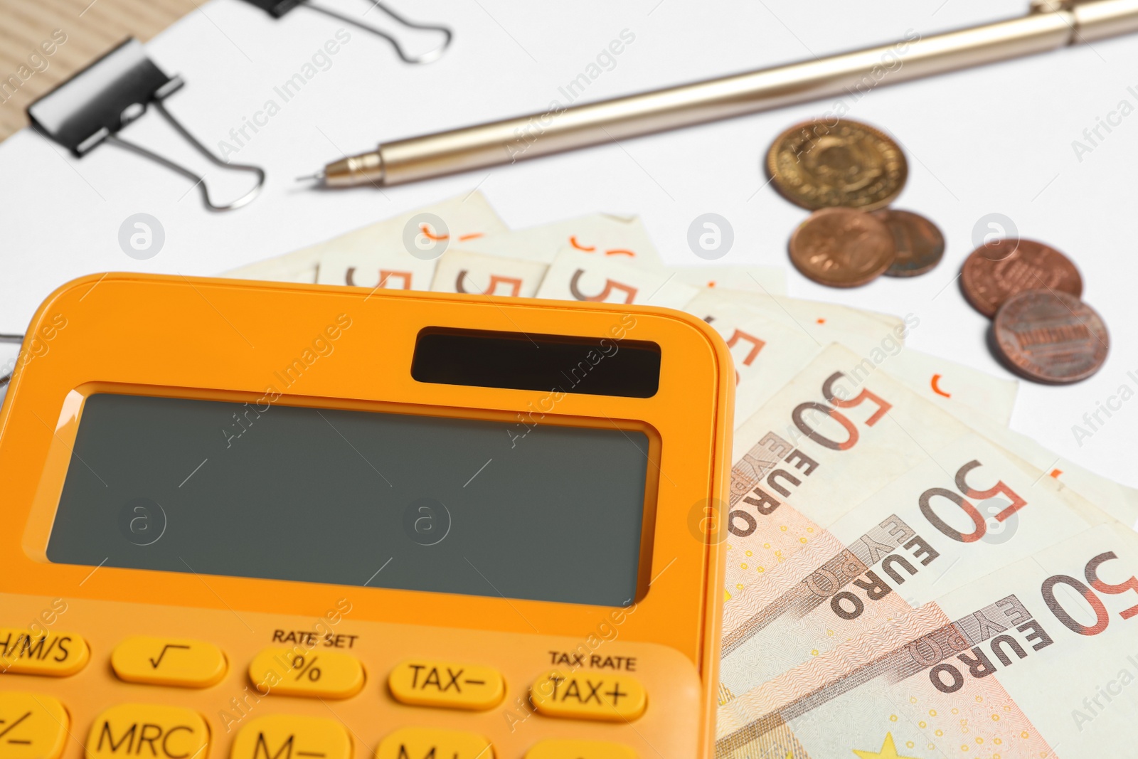 Photo of Calculator, paper and money, closeup. Tax accounting