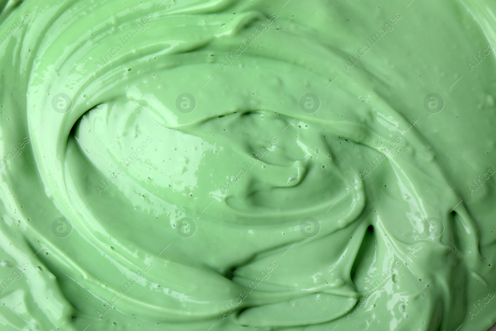 Photo of Texture of light green professional face mask as background, closeup