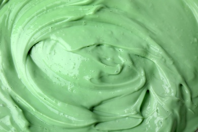 Texture of light green professional face mask as background, closeup