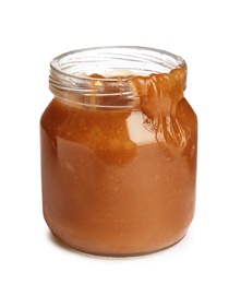 Photo of Jar of tasty caramel sauce isolated on white