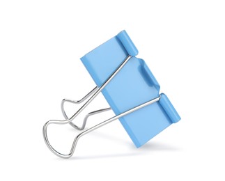 Photo of Light blue binder clip isolated on white. Stationery